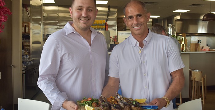 John Atanassov and Joel King, co-owners of Blu Kouzina, are eager to serve and get to know new customers at their new location at University Town Center.