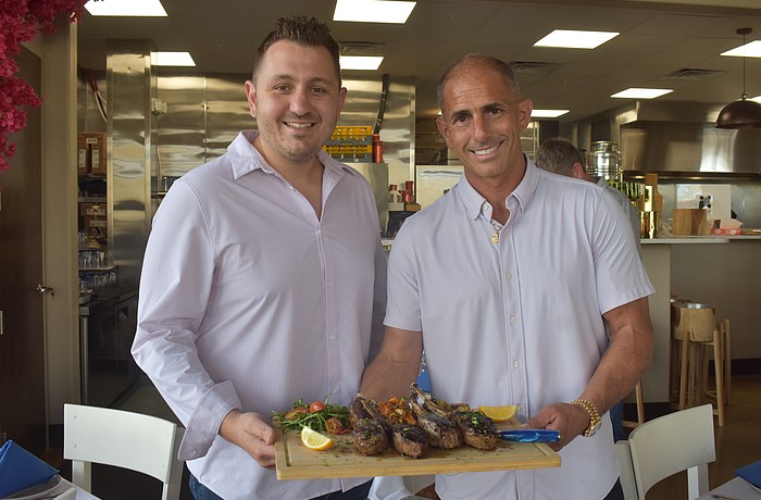 John Atanassov and Joel King, co-owners of Blu Kouzina, are eager to serve and get to know new customers at their new location at University Town Center.