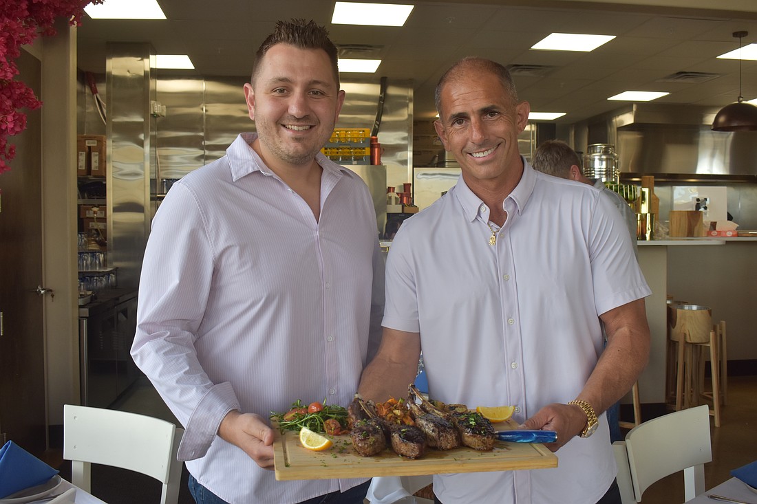 John Atanassov and Joel King, co-owners of Blu Kouzina, are eager to serve and get to know new customers at their new location at University Town Center.