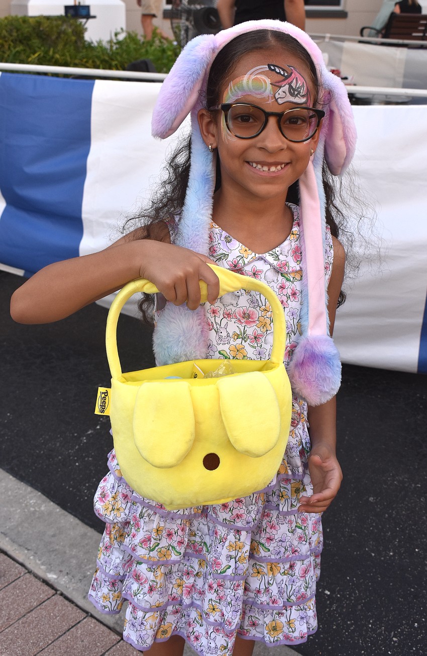 Summerfield's Oriana Vargas says she is happy to receive festive goodies to take home in honor of the Easter holiday weekend at Music on Main.