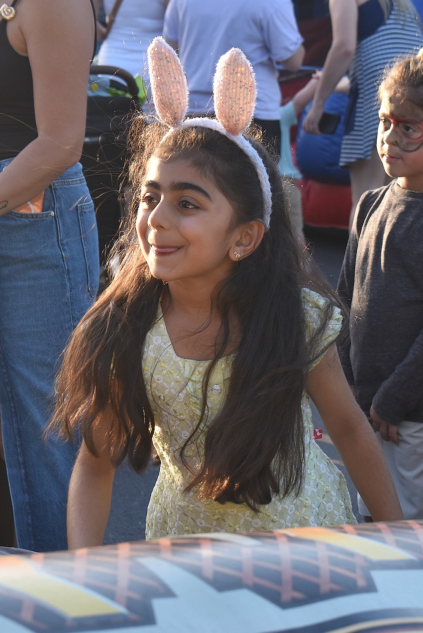Lakewood Ranch's Trisha Padia, 6, plays skee ball for the first time ever at Music on Main April 3.