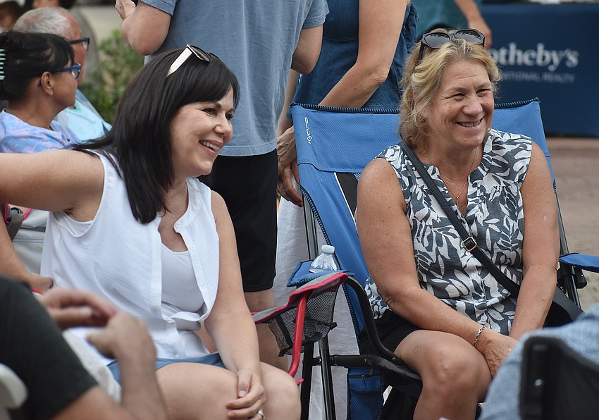 Lakewood Ranch's Collette DeSantis and Laurie Dobosh socialize during Music on Main April 3.