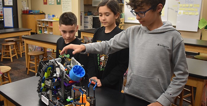 Team Thunderbolts members Kenny Van Slyck, Avery Szuma and Matteo Saviano won a Create Award, which rewards unique approaches to gameplay over the standard design, to qualify for The VEX Robotics World Championship.
