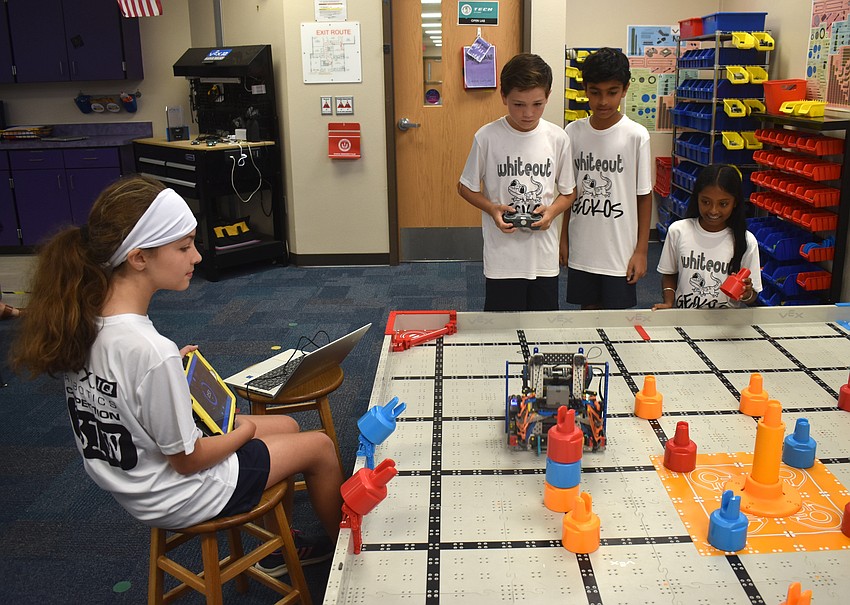 Keira Summerlee, Chris Hoke, Shaan Kuchibhatla and Parini Adsod of the White Geckos won a VEX IQ Think Award, which qualified them for the world competition.