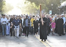 Rev. Mason Waldhauser, associate rector for adult formation at Church of the Redeemer, leads the walk.