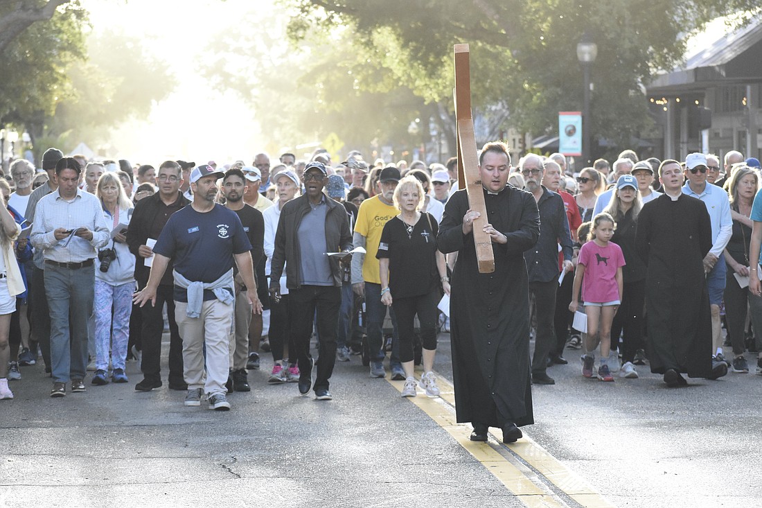 Rev. Mason Waldhauser, associate rector for adult formation at Church of the Redeemer, leads the walk.