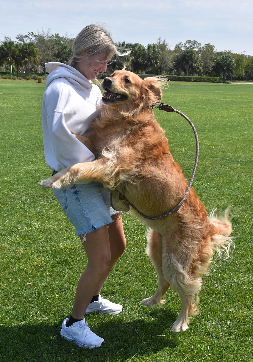 Angelina Goesch and her 4-year-old Golden retriever Maple play at Bob Gardner Community Park. Maple loves other dogs and wants to meet new friends.