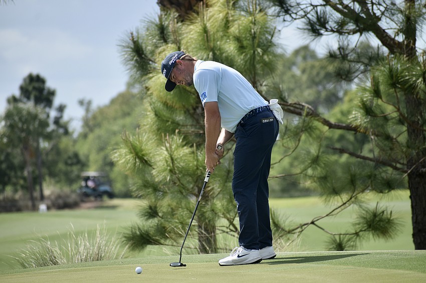 Cooper Dossey watches his putt near the cup of the 10th hole. He was six under par through 16 holes at the time play was suspended — good for a fifth-place tie.