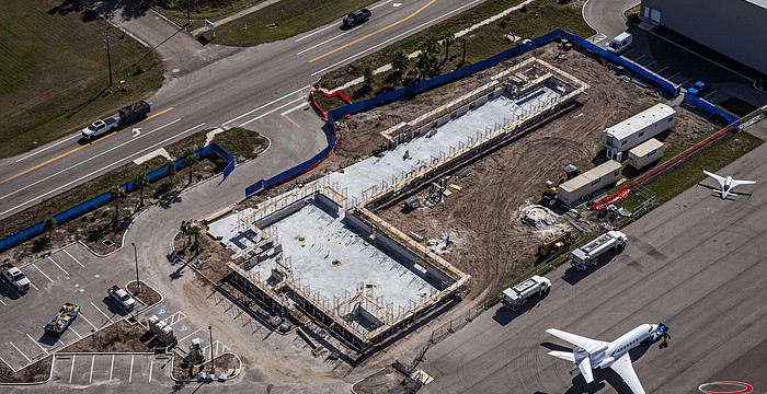 Construction has advanced quickly from Feb. 8 when this aerial photo was taken. The vantage point shows how close the school is from one of the runways at the Sarasota Bradenton International Airport.