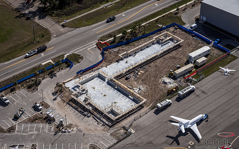 Construction has advanced quickly from Feb. 8 when this aerial photo was taken. The vantage point shows how close the school is from one of the runways at the Sarasota Bradenton International Airport.