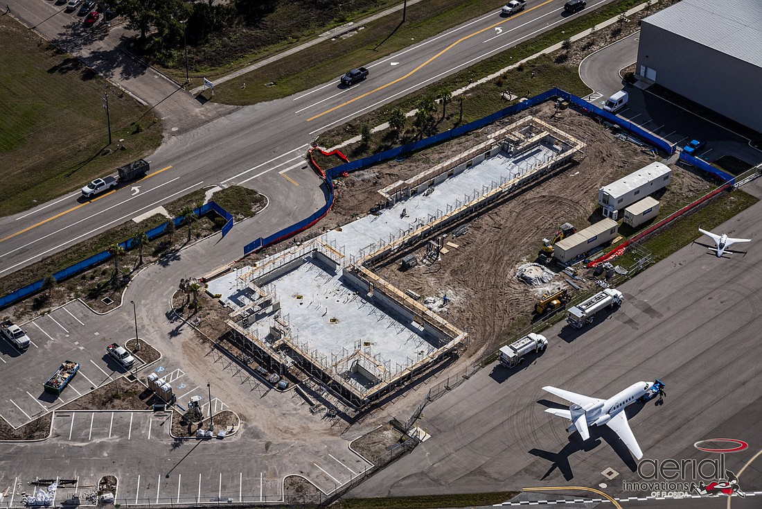 Construction has advanced quickly from Feb. 8 when this aerial photo was taken. The vantage point shows how close the school is from one of the runways at the Sarasota Bradenton International Airport.