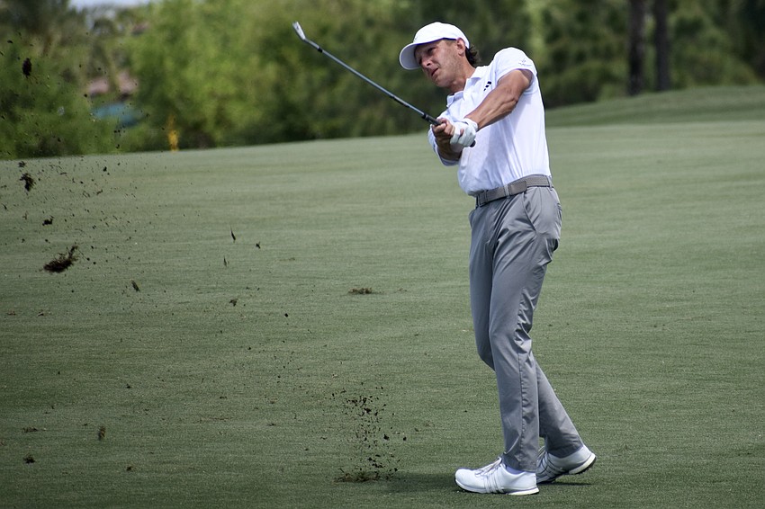 Peter Kuest digs up some dirt with his approach shot on the first hole. The 27-year-old American shot two under par in the third round, but fell 10 places.