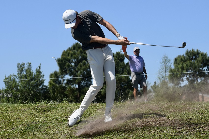 Jackson Van Paris hits an iron to get back to the 14th fairway. The 22-year-old American carded four under par in the third round.