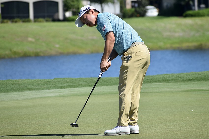 Yuta Sugiura putts on the first green. He finished even in his third round, but at six under par overall, is tied for 49th place.