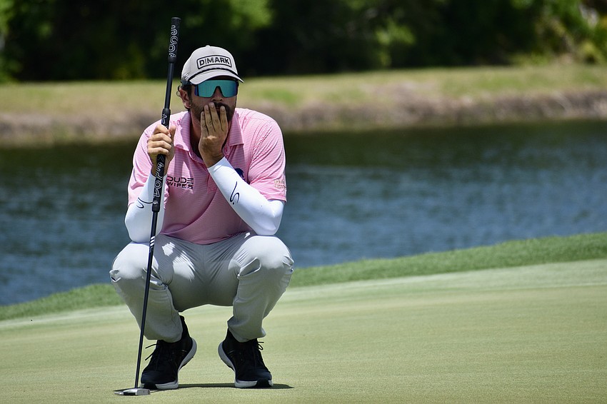 Jay Card III contemplates his pending putt on the first-hole green. He was in second place following the first and second rounds, and now, is tied for third entering the final day.