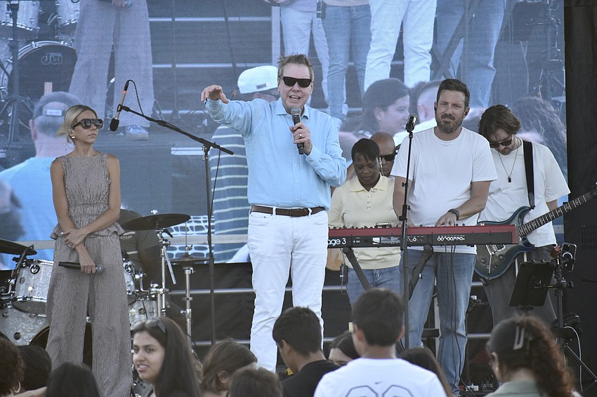 Pastor John Cross (center) speaks to attendees during the Good Friday Worship Service.