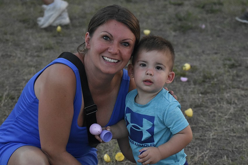 Milena Jones and Danny Jones, 1, hunt for eggs together.