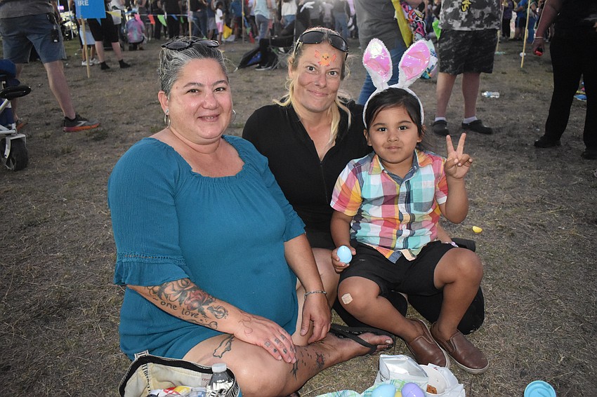 Toni Colorado, her sister Claudia Guardino, and her son Dante Colorado, 5, enjoy a picnic.