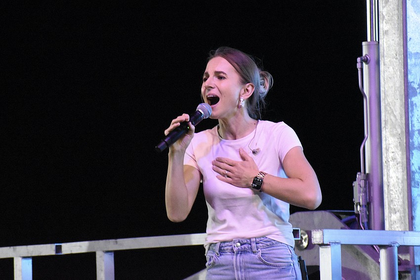 Ollha Naumets sings during a worship concert.