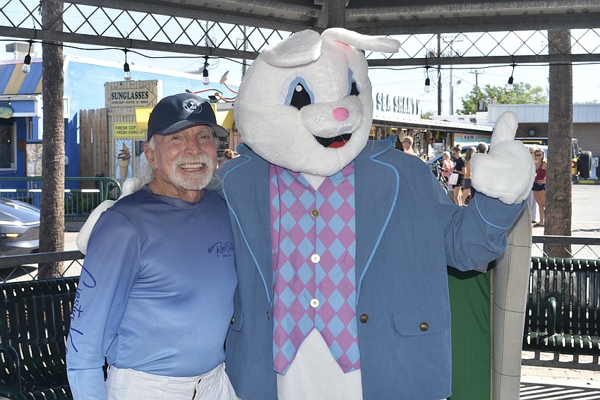 Jay Lancer, a Siesta Key Village property owner and developer, greets the Easter Bunny.
