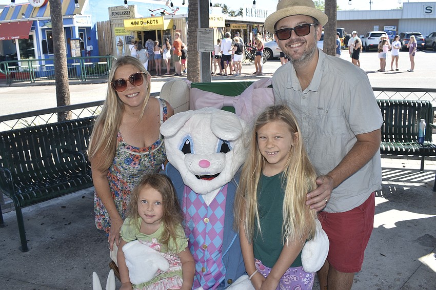 Sara Layman, Nora Layman, 4, Brooklyn Layman, 7 and Justin Layman meet the Easter Bunny.