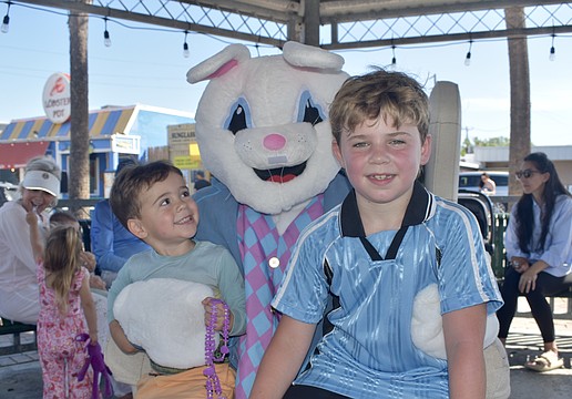 Jack Dudonis, 3, and Maxwell Dudonis, 9 meet the Easter Bunny.