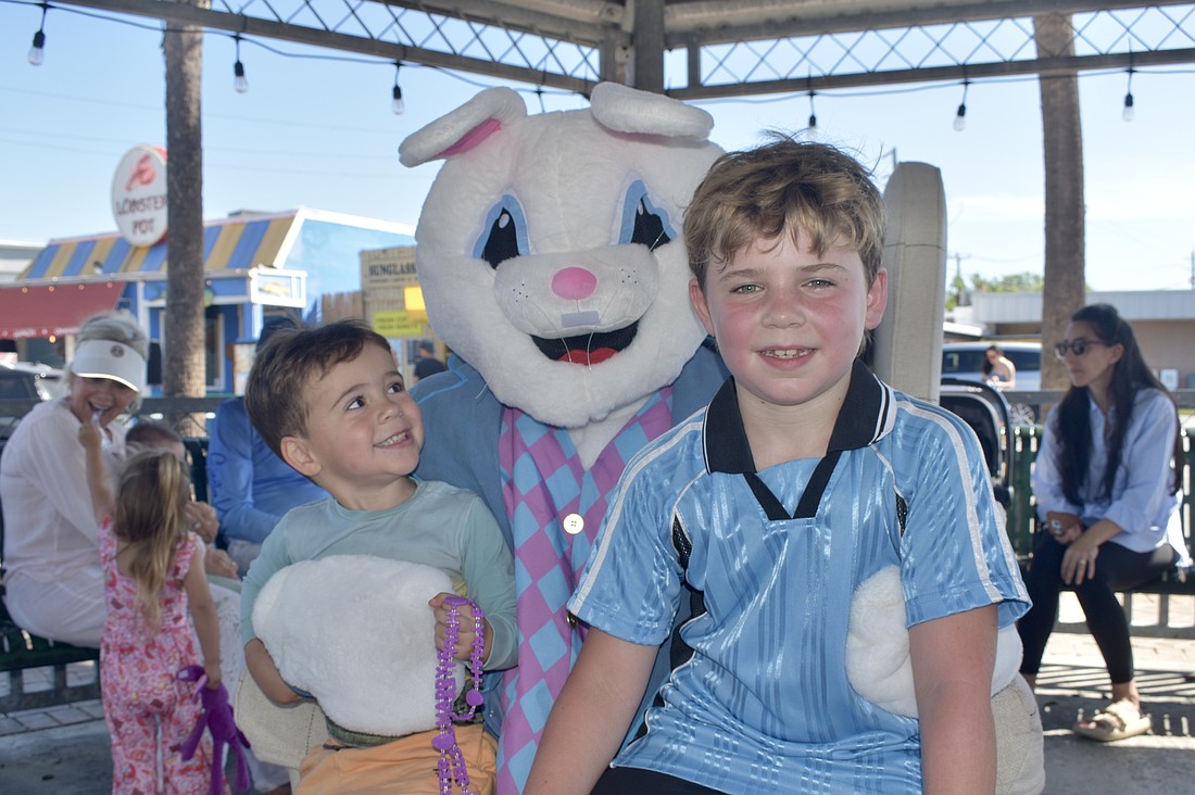 Jack Dudonis, 3, and Maxwell Dudonis, 9 meet the Easter Bunny.