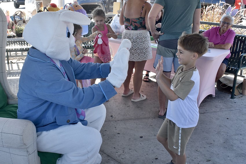 Davyd Kotliar, 5, meets the Easter Bunny.
