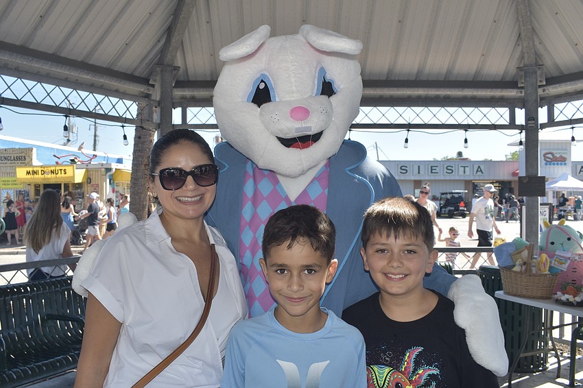 Maria Morley, her son Lorenzo Morley, 8, and Nico Manzano, 8, meet the Easter Bunny.
