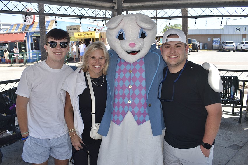 Matthew Kreusch, 17, his mom Suzie Kreusch, and brother Nick Kreusch, 25, of Ohio, meet the Easter Bunny. Suzie Kreusch used to visit Siesta Key as a child, and wanted to take her sons there during Spring Break.