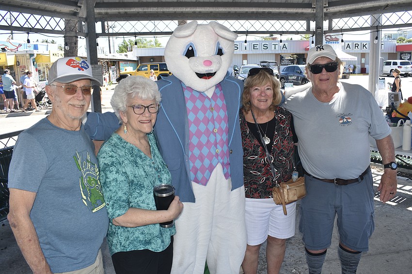 Paul and Dinah Haas, and Marilyn Buka and Randy Vomier visit the Easter Bunny.