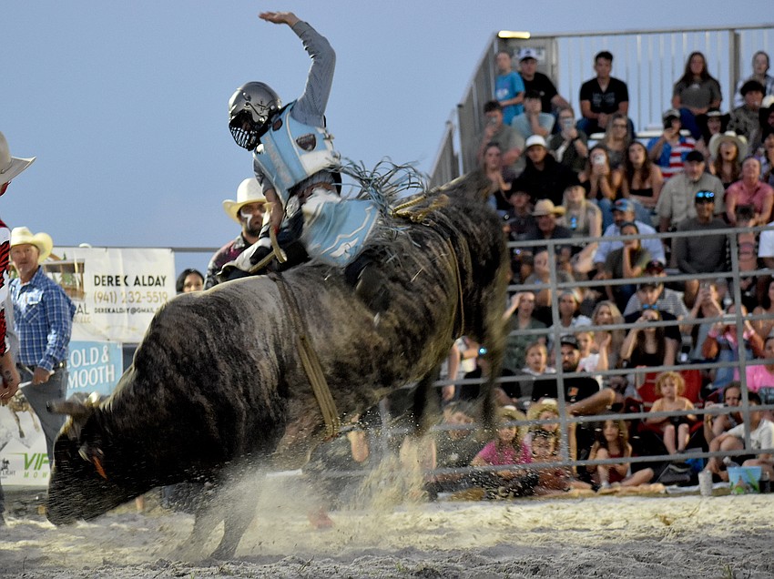 Jefferson Silva rides a bull at the Dakin Dairy Farms' Bull Bash April 4.