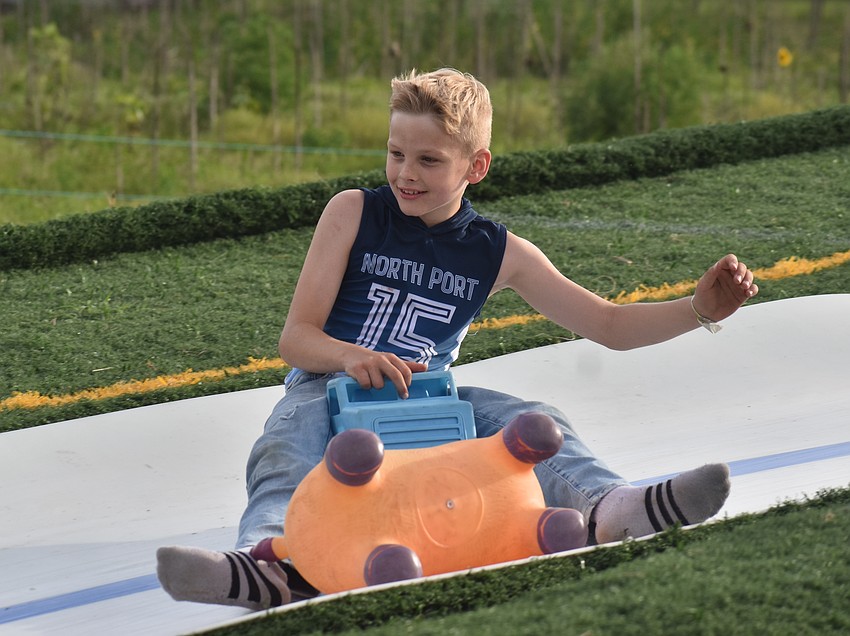 Port Charlotte's Patrick Smith, 9, zips down the slide at Dakin Dairy Farms.