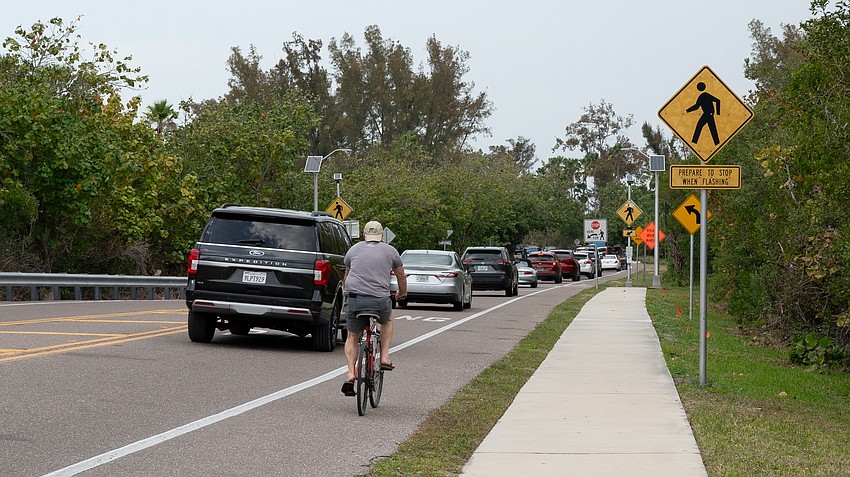 Longboat residents and employees commonly pedal past traffic heading north off the island as Bradenton Beach backups extend even south of the Longboat Pass Bridge during peak season. Longboat residents and employees commonly pedal past traffic heading north off the island as Bradenton Beach backups extend even south of the Longboat Pass Bridge during peak season.