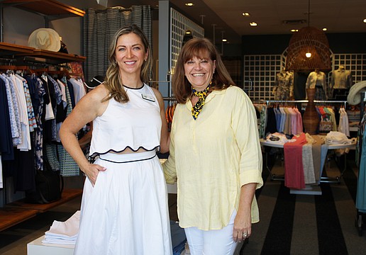 Amy Bott, executive director of Bernie's Book Bank's Florida Suncoast branch, connects with J. McLaughlin manager Melanie Dale at the boutique's recent Sip and Shop event supporting the incoming nonprofit.