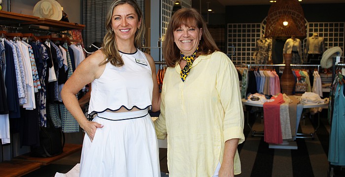 Amy Bott, executive director of Bernie's Book Bank's Florida Suncoast branch, connects with J. McLaughlin manager Melanie Dale at the boutique's recent Sip and Shop event supporting the incoming nonprofit.