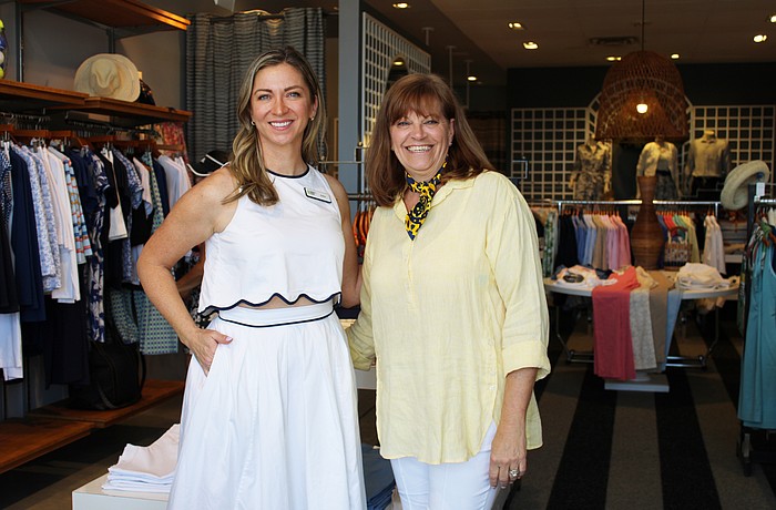 Amy Bott, executive director of Bernie's Book Bank's Florida Suncoast branch, connects with J. McLaughlin manager Melanie Dale at the boutique's recent Sip and Shop event supporting the incoming nonprofit.