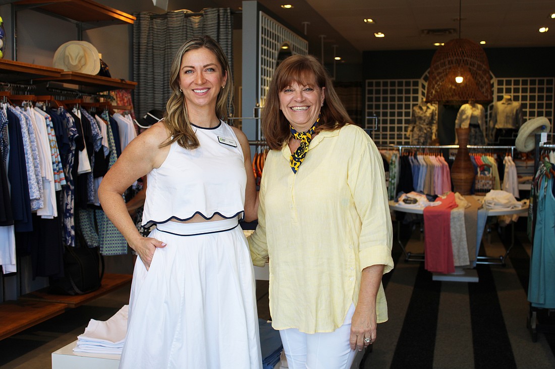 Amy Bott, executive director of Bernie's Book Bank's Florida Suncoast branch, connects with J. McLaughlin manager Melanie Dale at the boutique's recent Sip and Shop event supporting the incoming nonprofit.