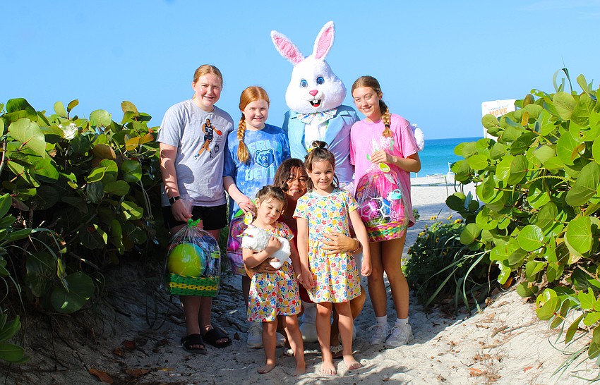 Katie, Emma and Maddie Smith, along with Maeve and Cecilia Mcauliff, join the Easter Bunny and coordinator Heather Diggins for the April 3 Easter egg hunt at Sand Cay Condominiums Beach Resort.