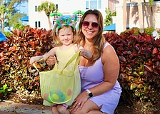 Lydia Lardner, 3, makes an impressive start filling up her Easter basket with Kelly Lardner and family at the April 3 Sand Cay Condominiums Beach Resort's Easter egg hunt, a beloved tradition at the resort for more than a decade.