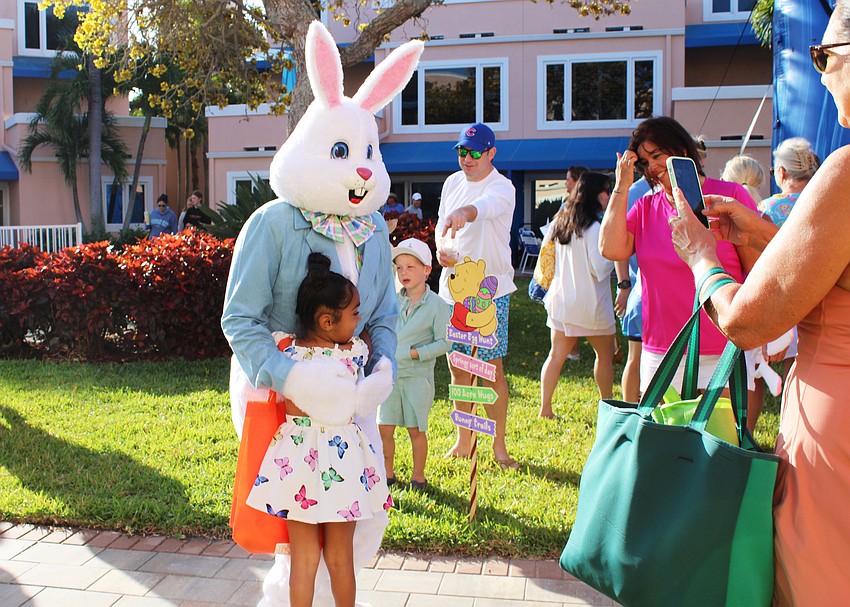 Leah Selph-Kelly gives the Easter Bunny a hug.