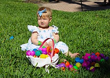 Emi Frydman checks out the basket of Easter eggs her family members found at the April 4 egg hunt at St. Armands Key Lutheran Church. The Easter activities, open to the public, made their return for the first time since the early 2020s through the efforts of church members.