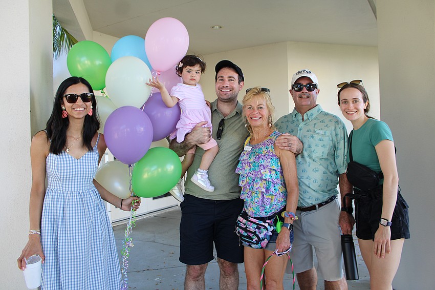 The Kober family — including Akriti, Mia, Bobby, Karen, Andy and Tricia — arrives early at the St. Armands Key Lutheran Church Easter festivities on April 4. Mia was a fan of the pastel balloons decorating the grounds.