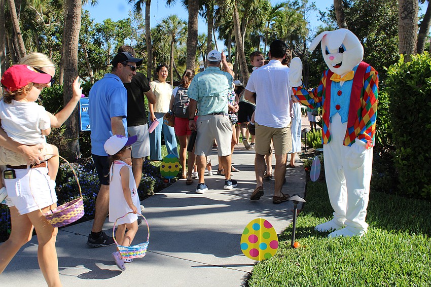 The Easter Bunny greets families making their way into the Meditation Garden for the egg hunt.