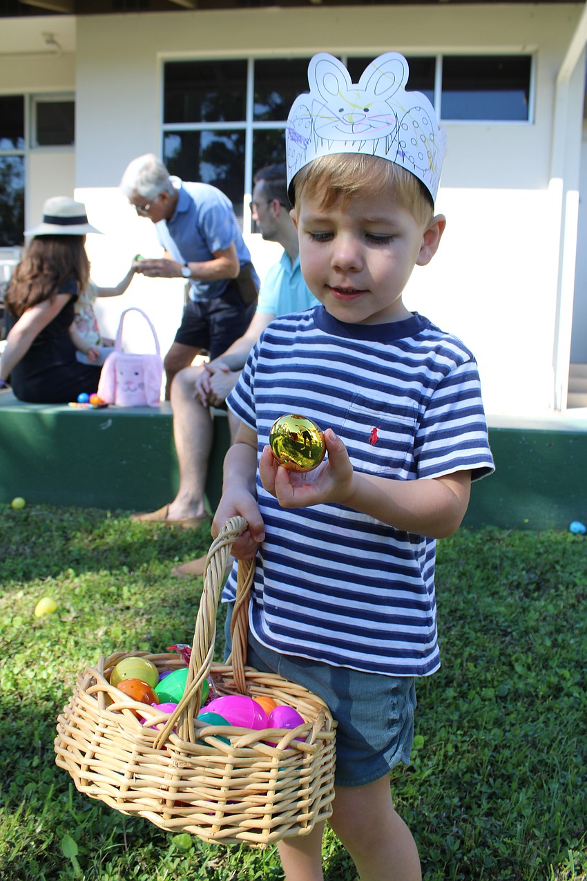 Beau Hopen said he had to do some searching to find his golden egg at the St. Armands Key Lutheran Church Easter egg hunt.