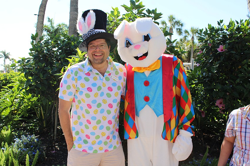 St. Armands Key Lutheran Church Minister of Music Michael Bodnyk, one of the coordinators of the return of the church's Easter egg hunt this year, says hello to the Easter Bunny.