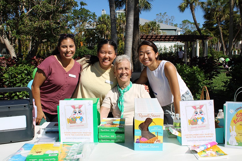 Volunteers Mey Paz and Maggie, Miriam and Jamie Dougherty help bring back the St. Armands Key Lutheran Church Easter egg hunt.
