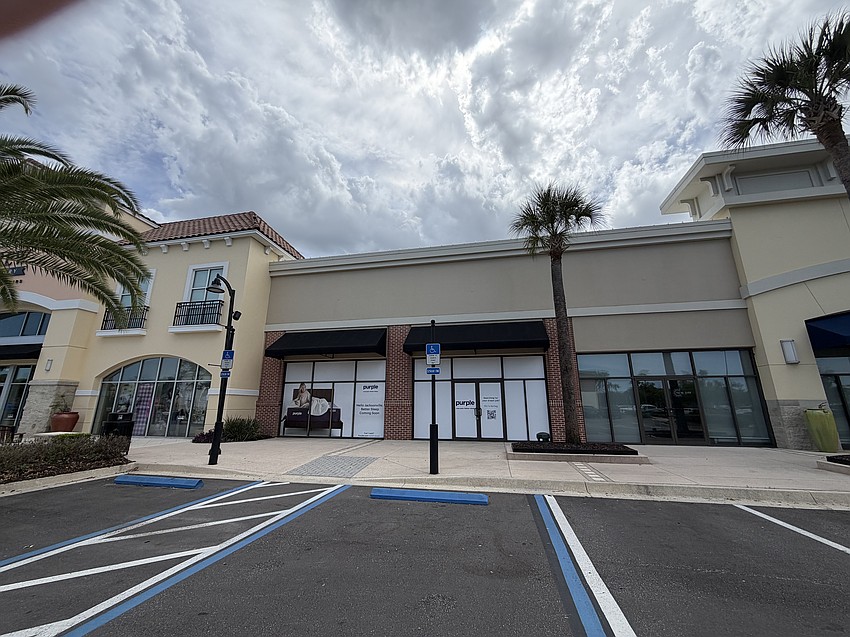 Signs are up in The Markets at Town Center for a Purple mattress and bedding store.