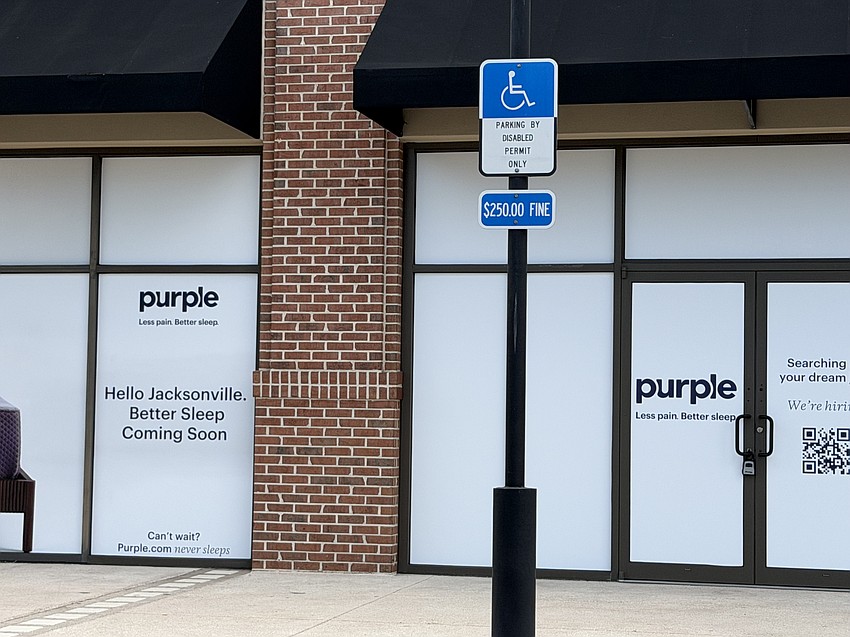 Signs are up in The Markets at Town Center for a Purple mattress and bedding store.
