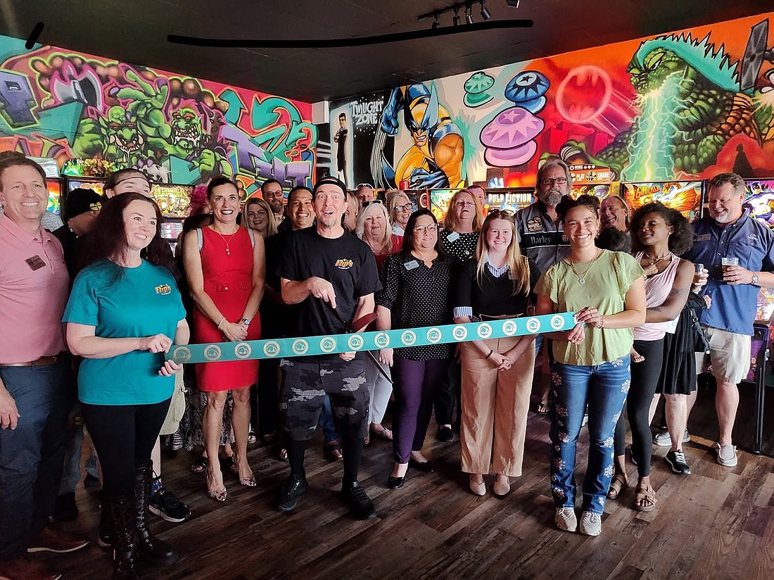 Ormond Beach Chamber of Commerce and Flip's Ormond Beach celebrate the grand opening of the new sports bar. Madeline Carduner/Ormond Beach Chamber of Commerce